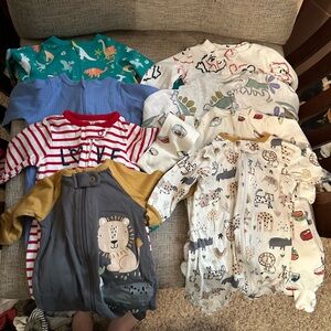 Bundle of 8 size newborn sleepers.